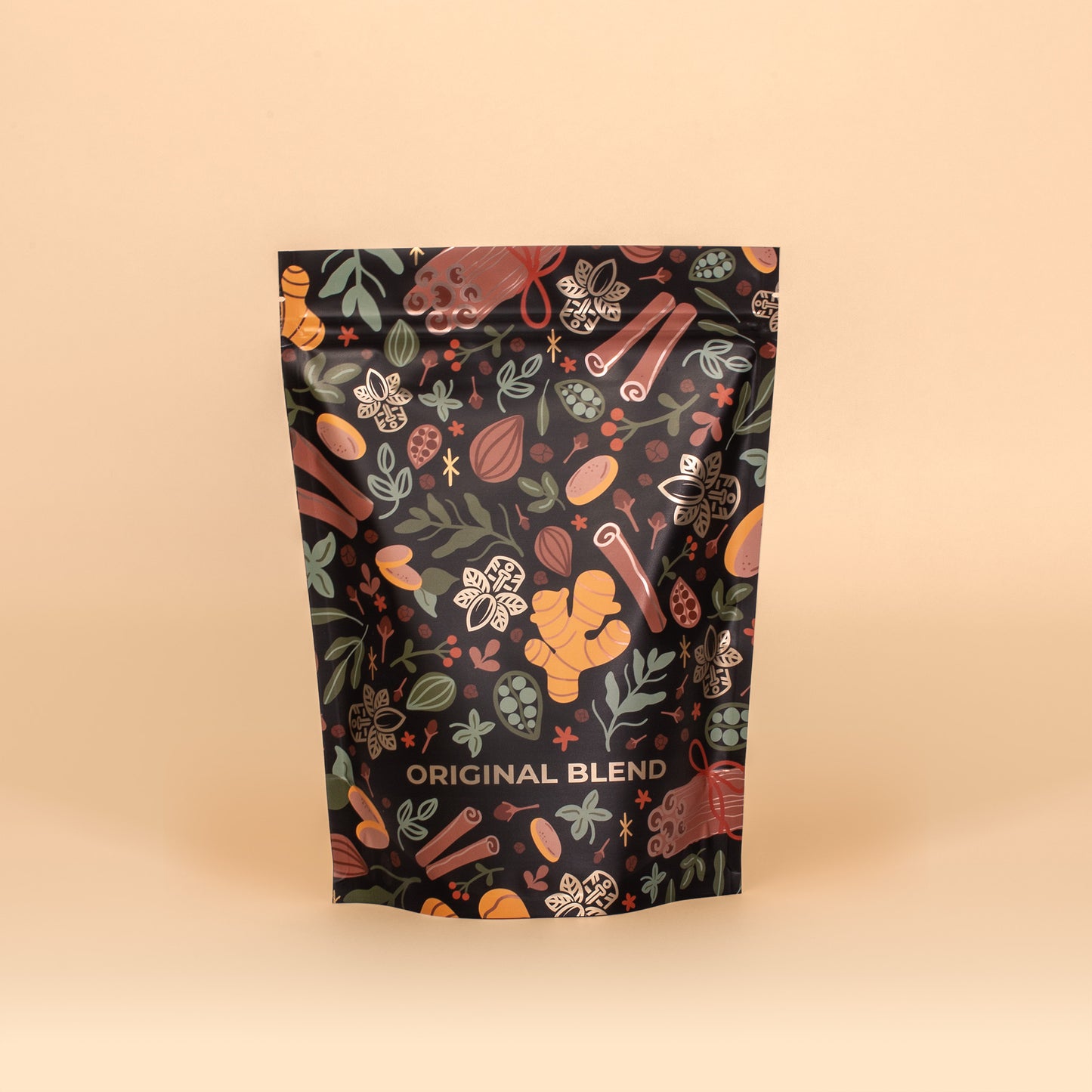 Original Blend Chai Latte black pouch, featuring spices and herbs like cinnamon, ginger, and leaves.