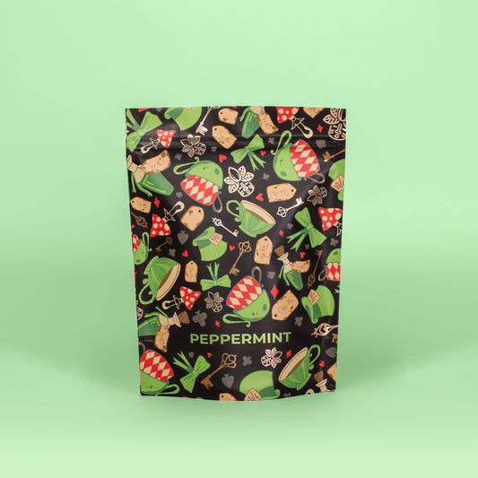Festive peppermint packaging on a light green background