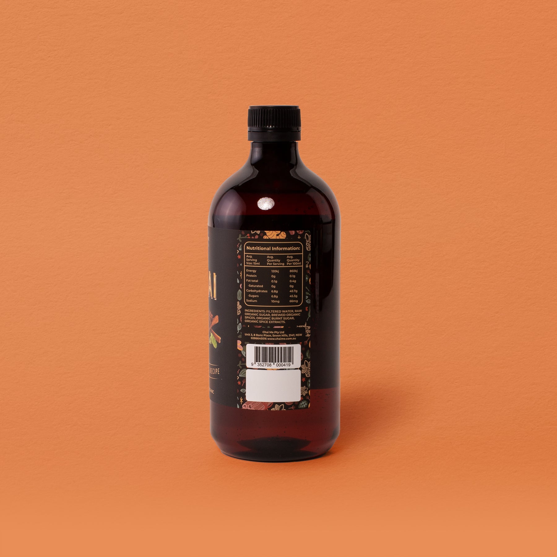 A dark raw sugar syrup bottle with a black label displaying nutritional information 