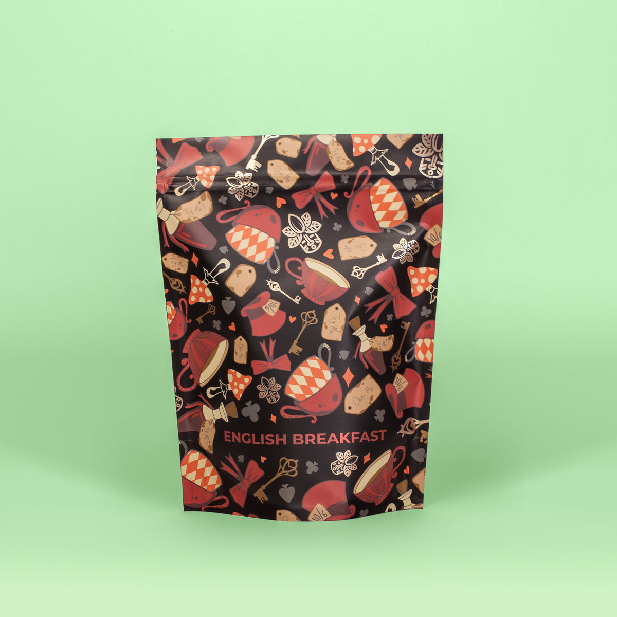 A packaged bag of English Breakfast pyramid tea with a colorful pattern of tea-related imagery.